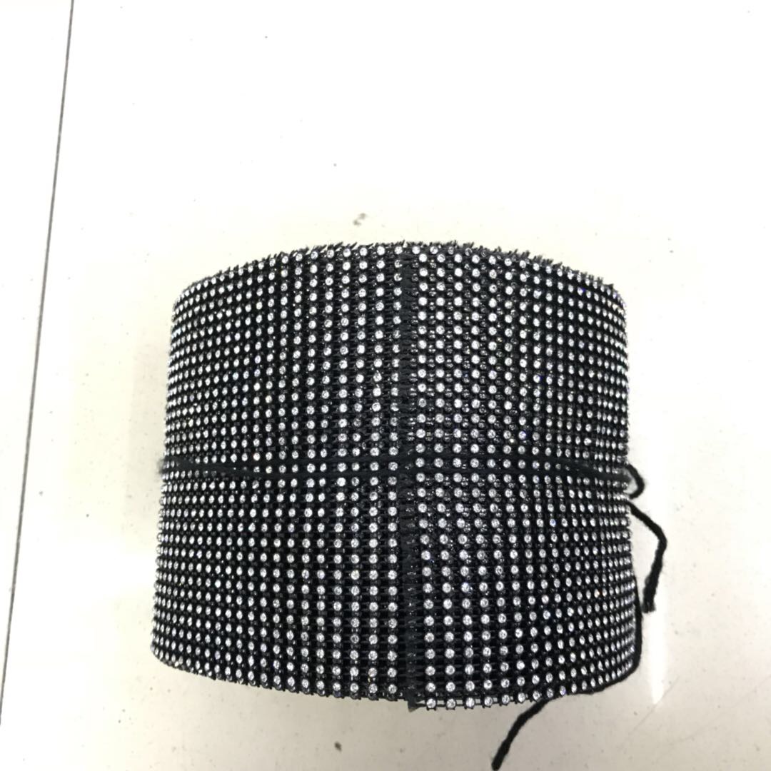 The black base of the dress is decorated with small silver rhinestones