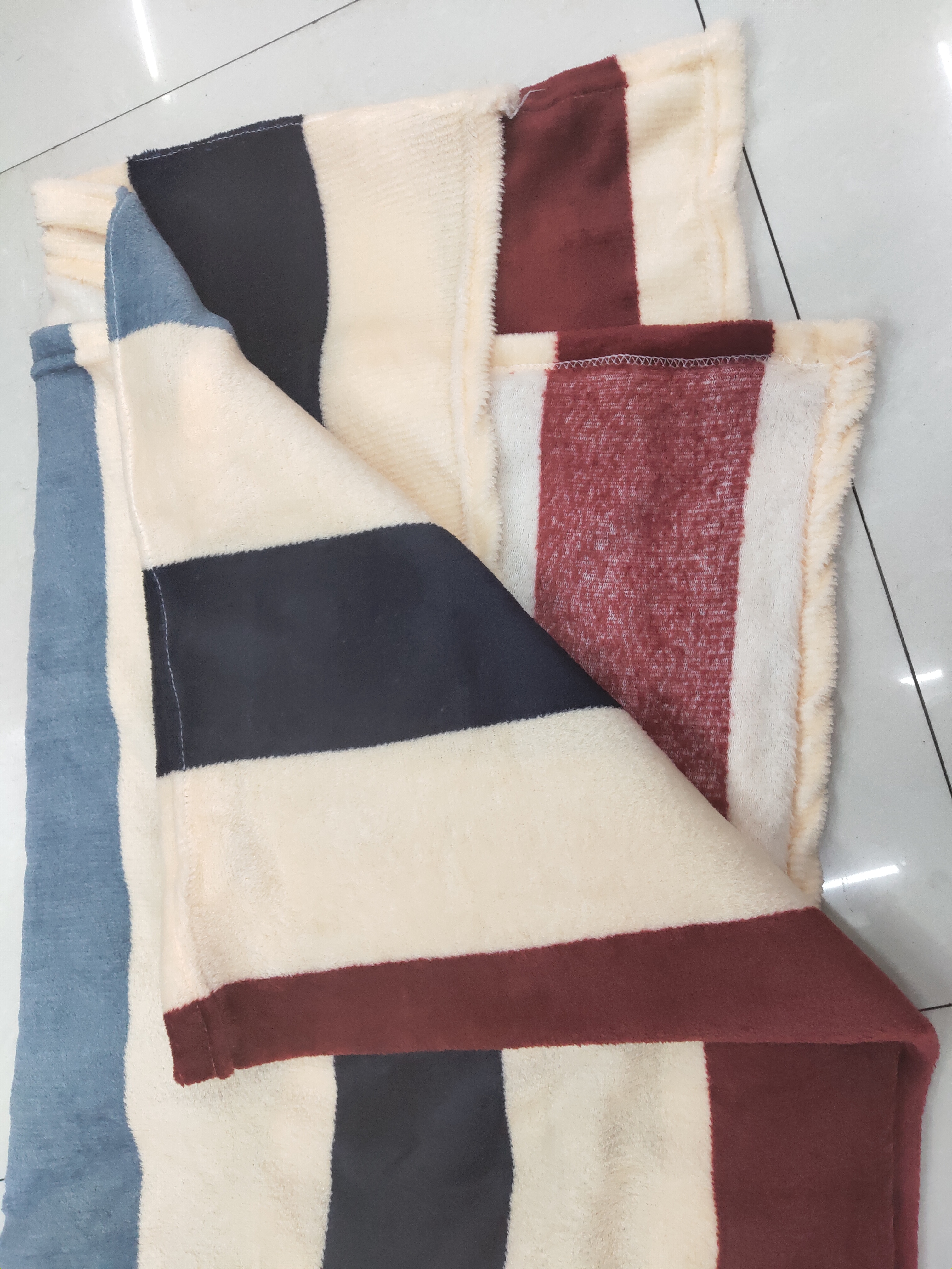 Close-up of the multicolored striped pattern showing detailed weave and texture