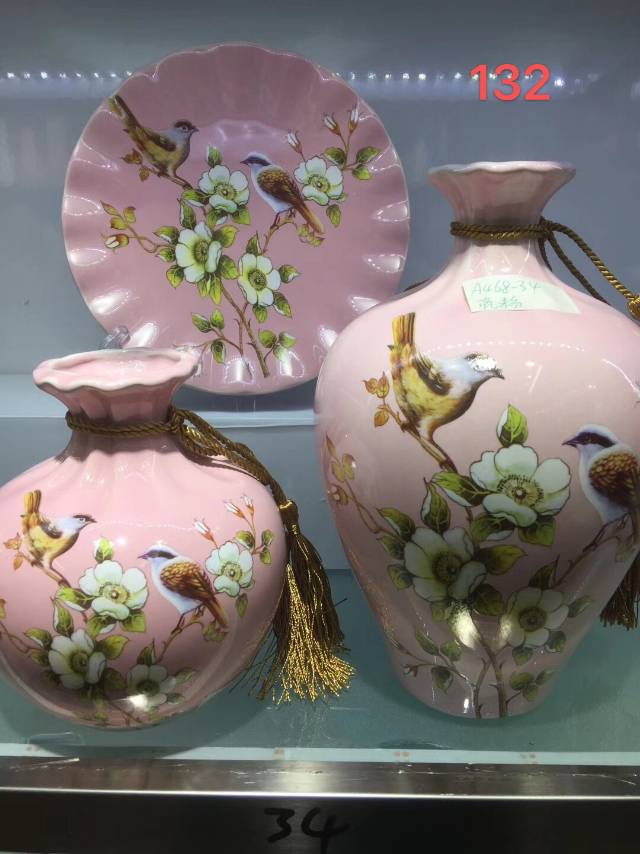 Pink ceramic vase with floral design thumbnail