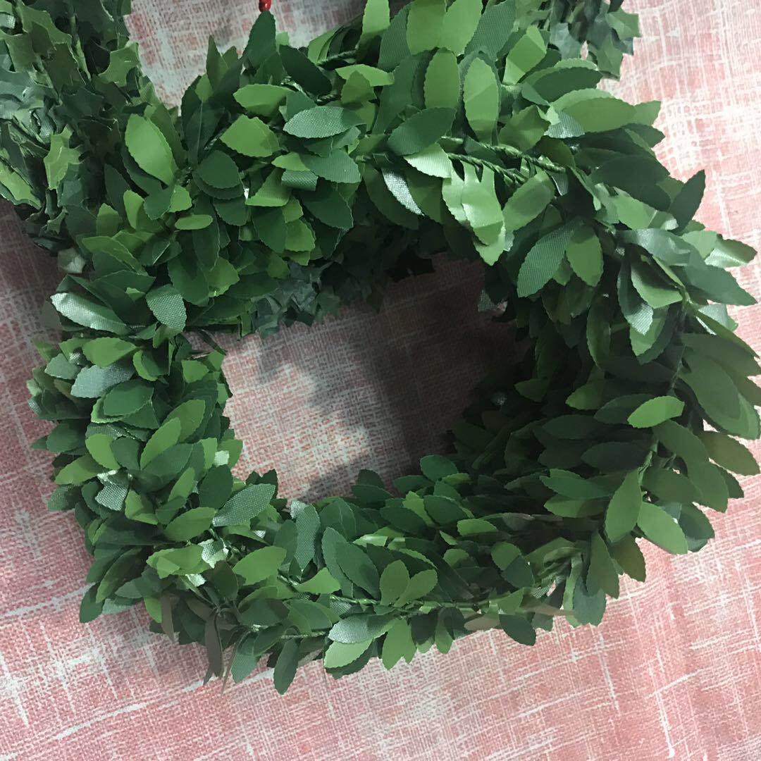 Decorative vines, artificial flowers, entwined pipes, artificial leaves, plastic green plants details Picture