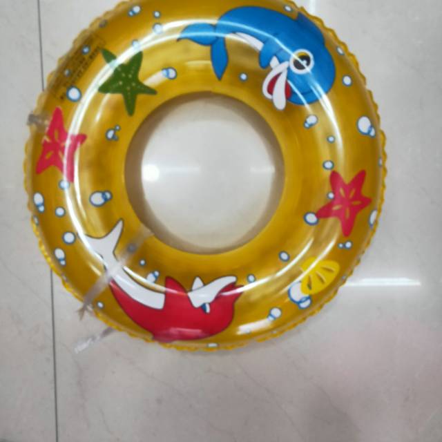 Children play with water toys in swimming ring thumbnail