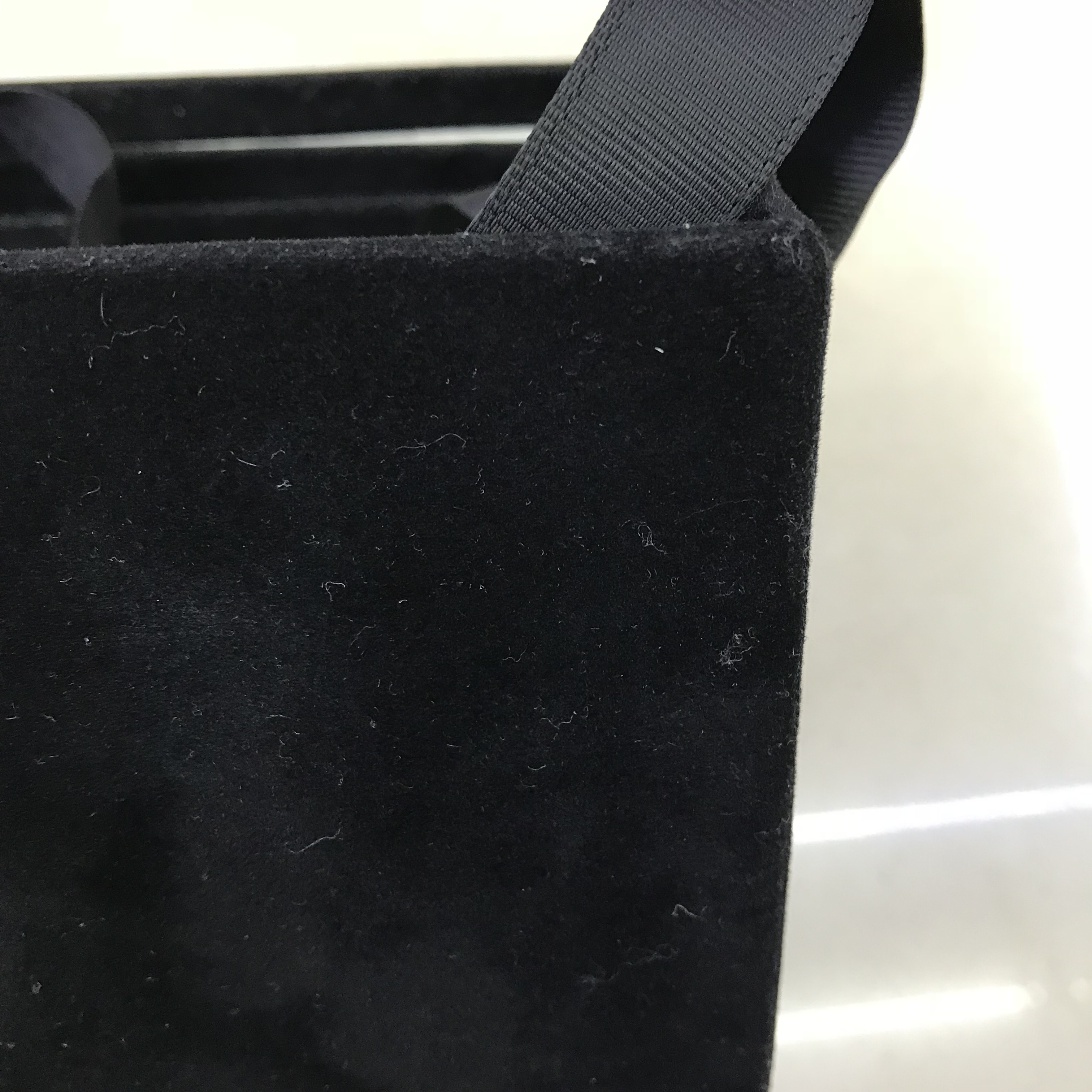 Black flannelette box with jewelry and notes inside