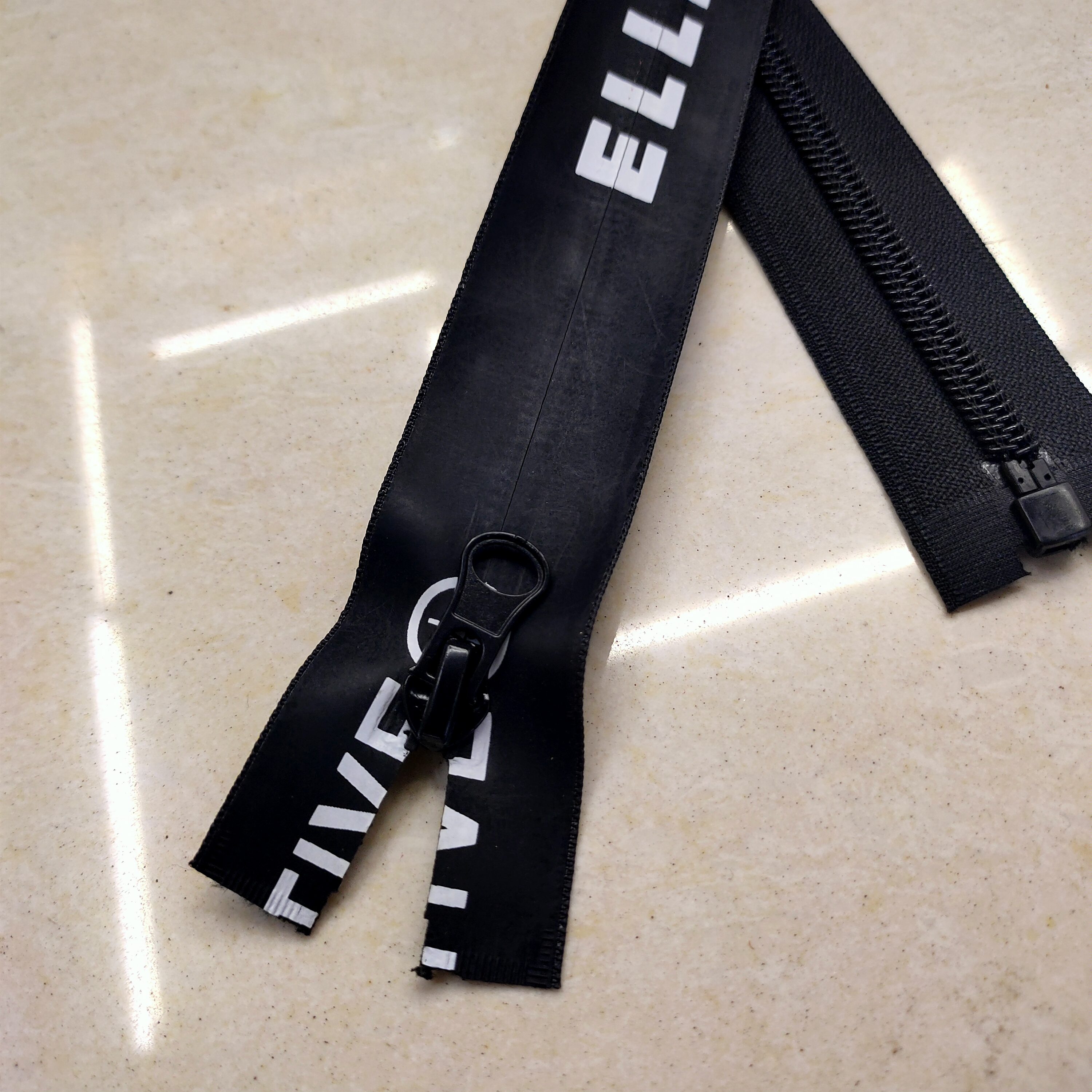 Close-up of invisible zipper teeth and nylon tape