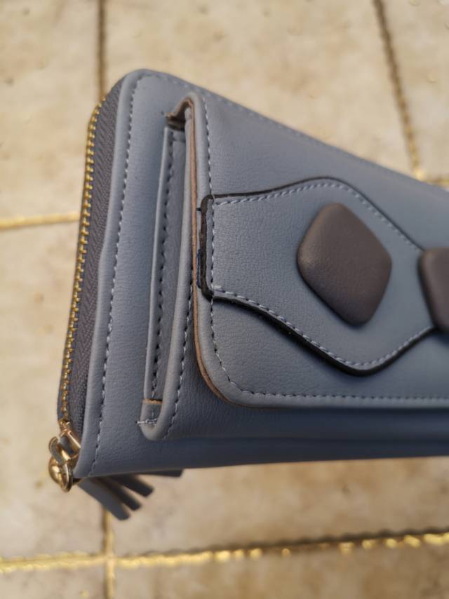 时尚简约大纽扣女士长款多功能三折女式钱包皮夹手拿包产品图