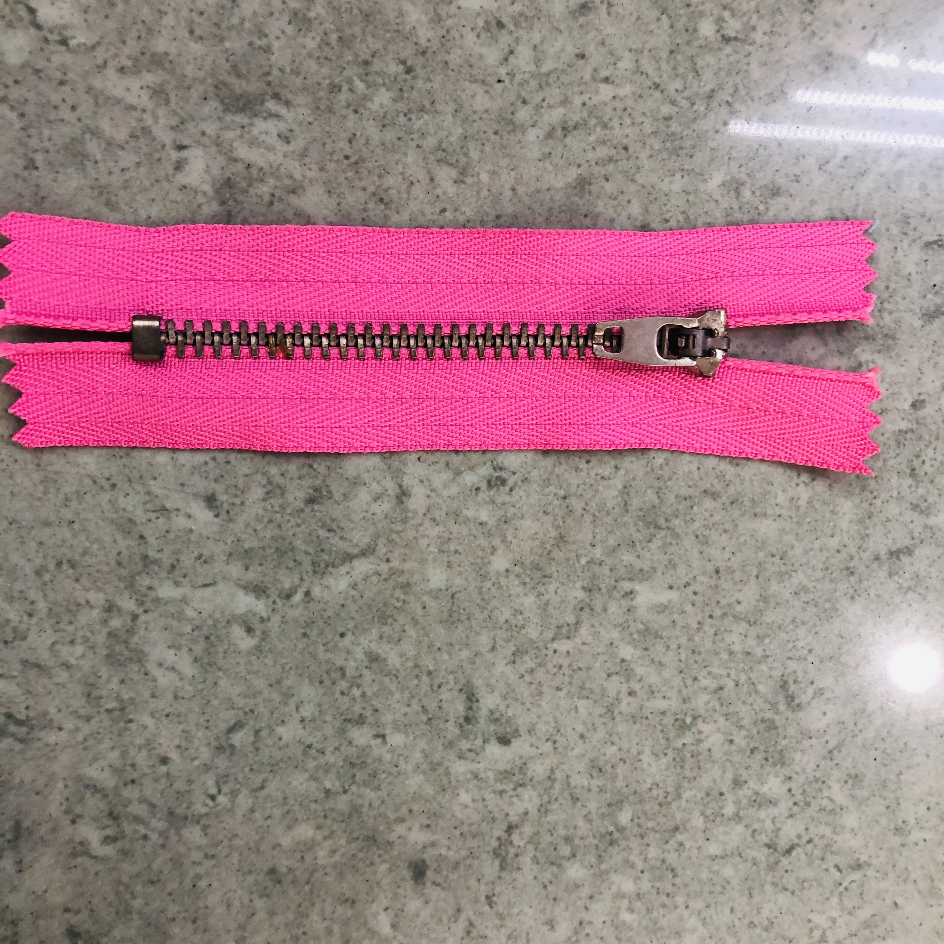 Zippers installed on jackets and backpacks in real-world use scenarios
