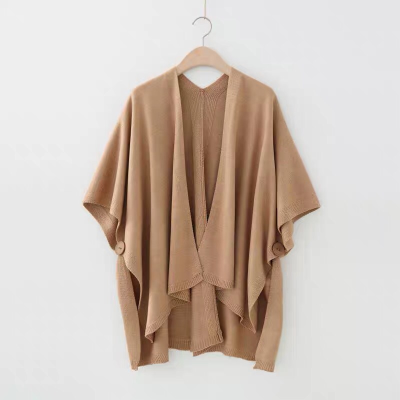 A long, versatile cape-style shawl sweater jacket for women in a knitted cardigan