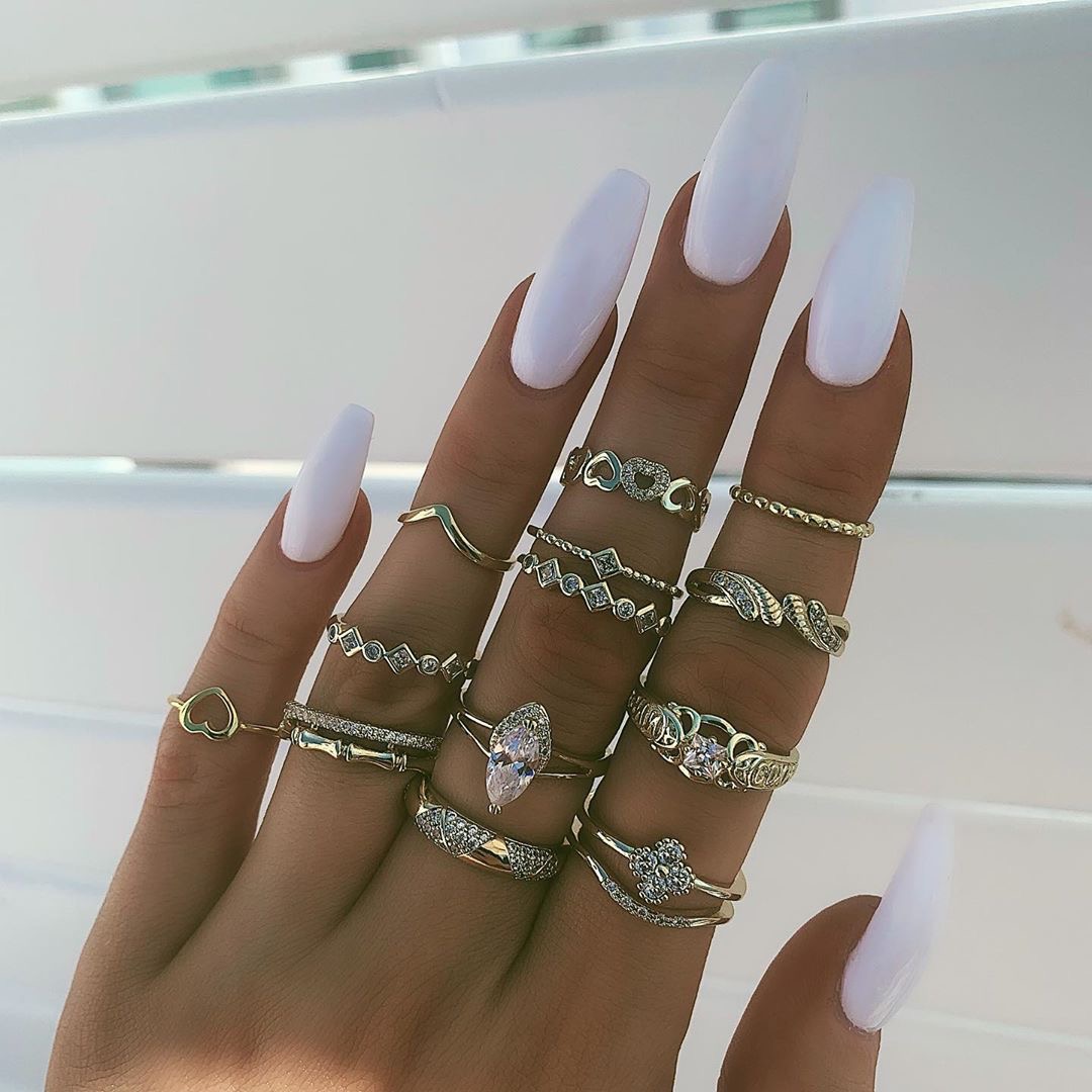 A collection of retro snake, elephant, rose, palm, leaf, silver and gold ring sets details Picture