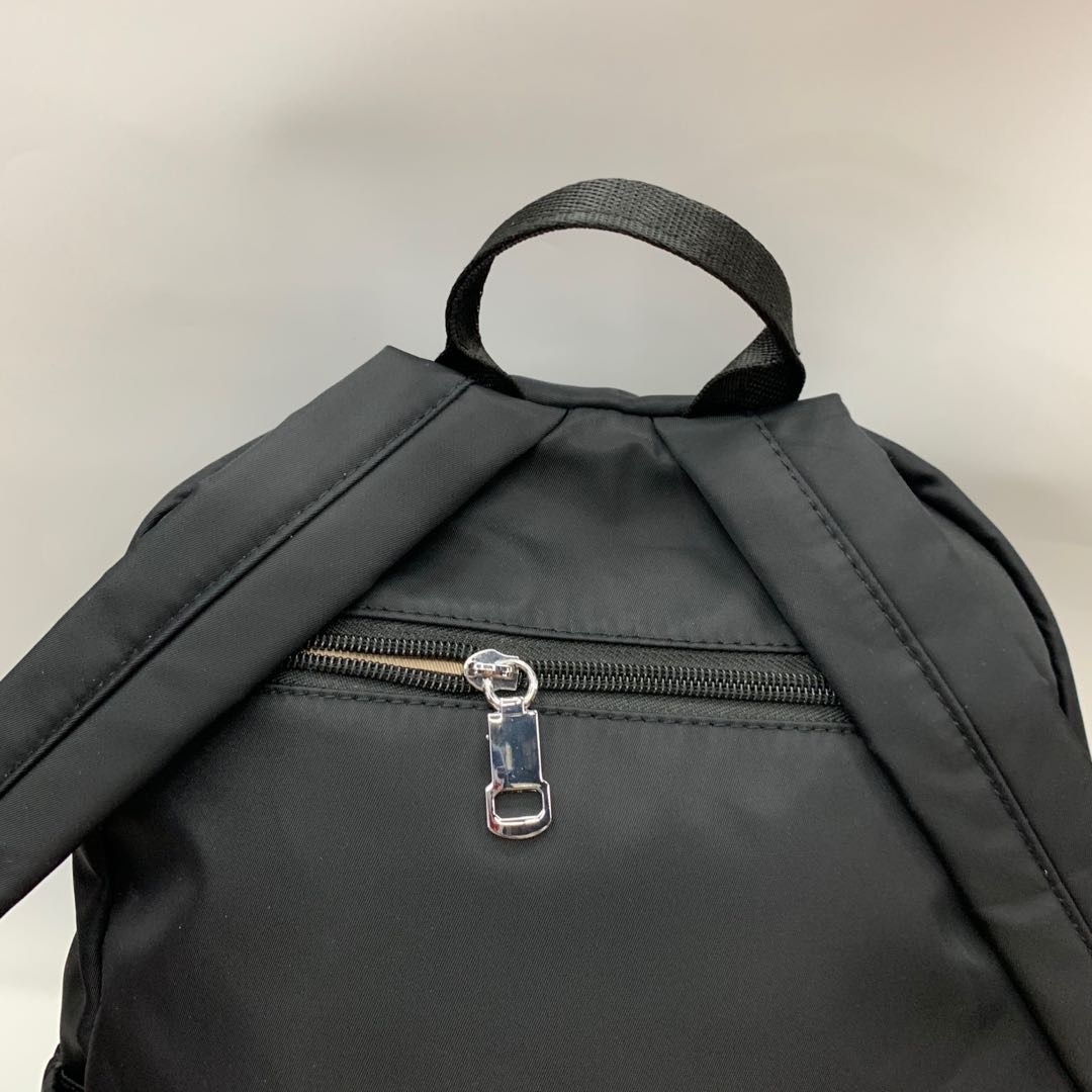 A pair of black women's washed nylon large-capacity backpacks for casual wear Specification image