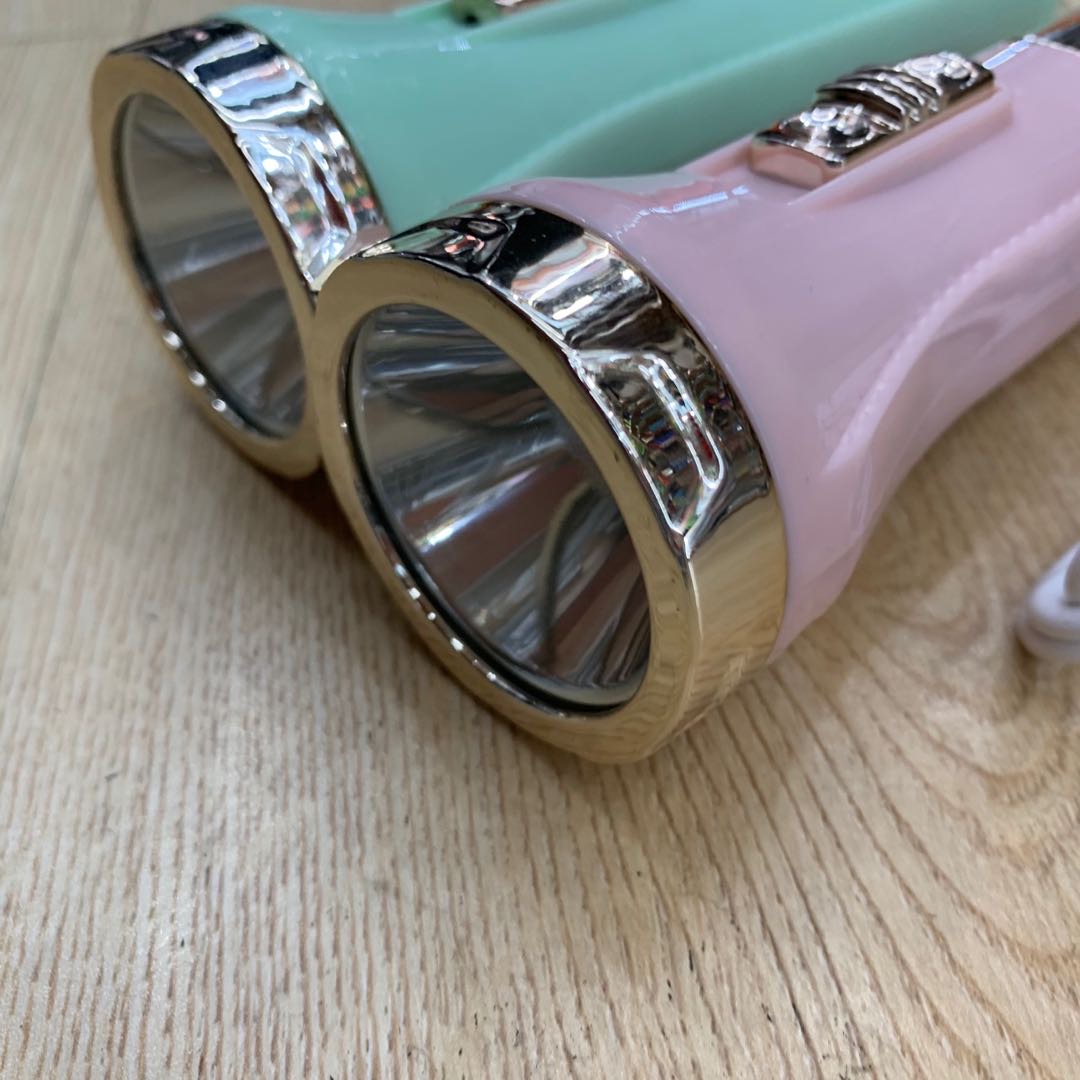 Portable flashlight in light blue and light purple details Picture