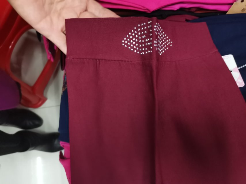 A deep red, diamond-encrusted cotton children's dress with leggings on top details Picture