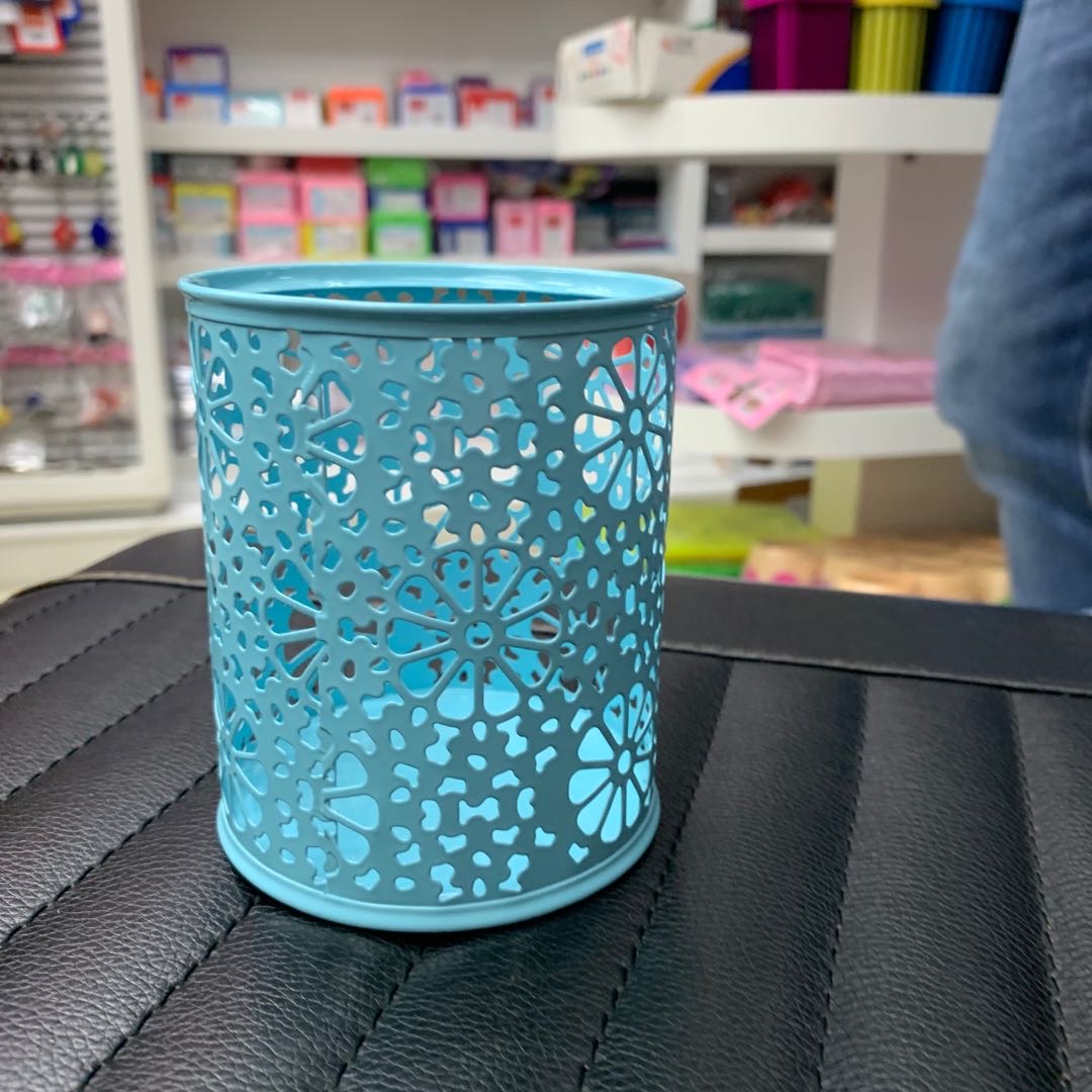 Blue hollowed-out pen holders for office supplies and stationery