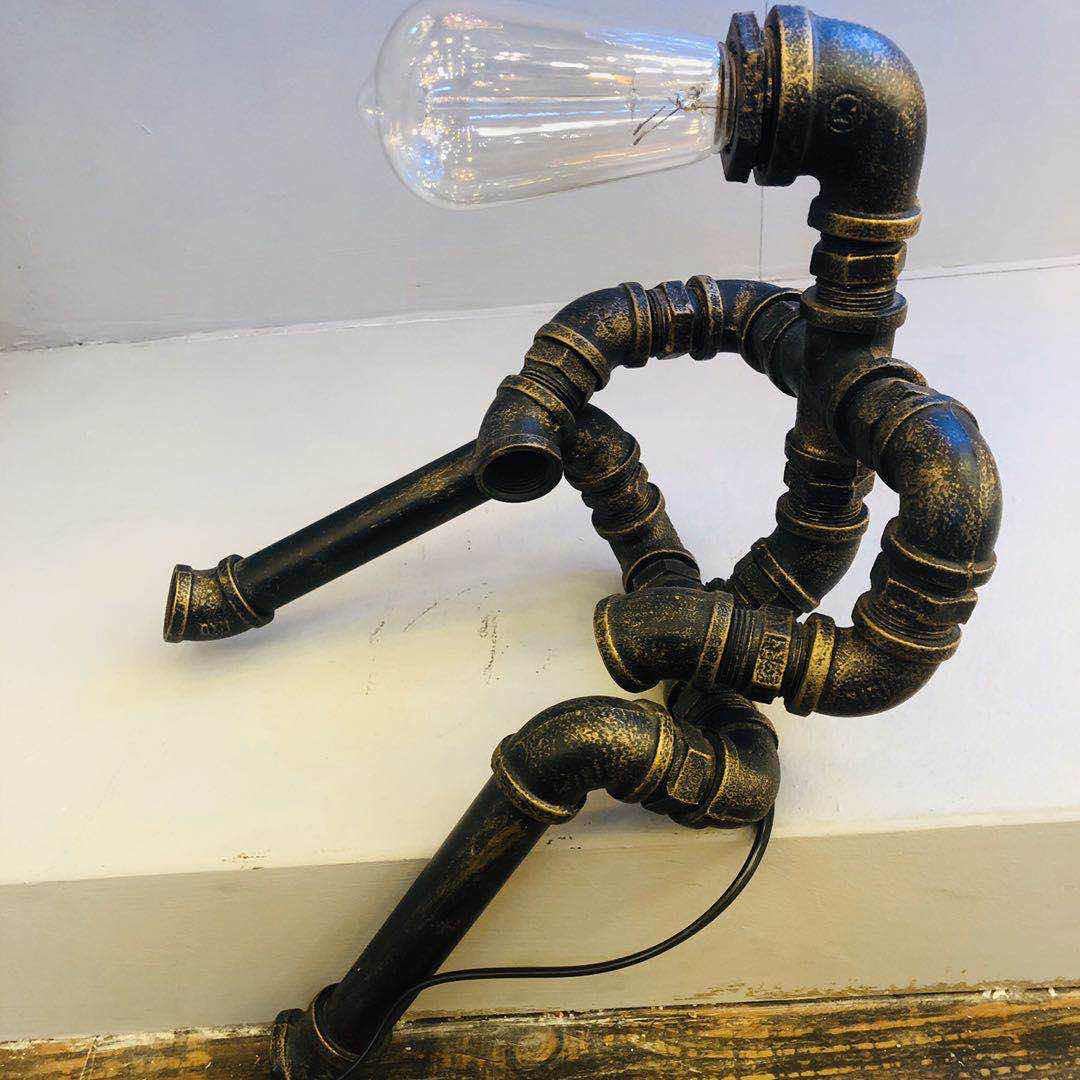 Industrial-style table lamp, personalized and creative decoration, coffee shop and bar table lamp, led retro and creative robot water pipe table lamp details Picture