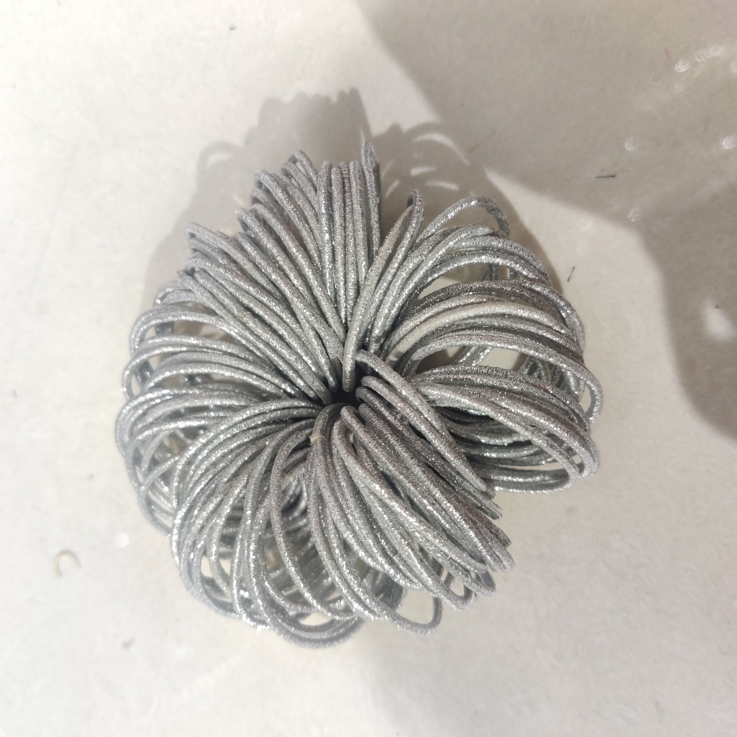 Close-up of high-elastic scrunchie material showing texture and stretch