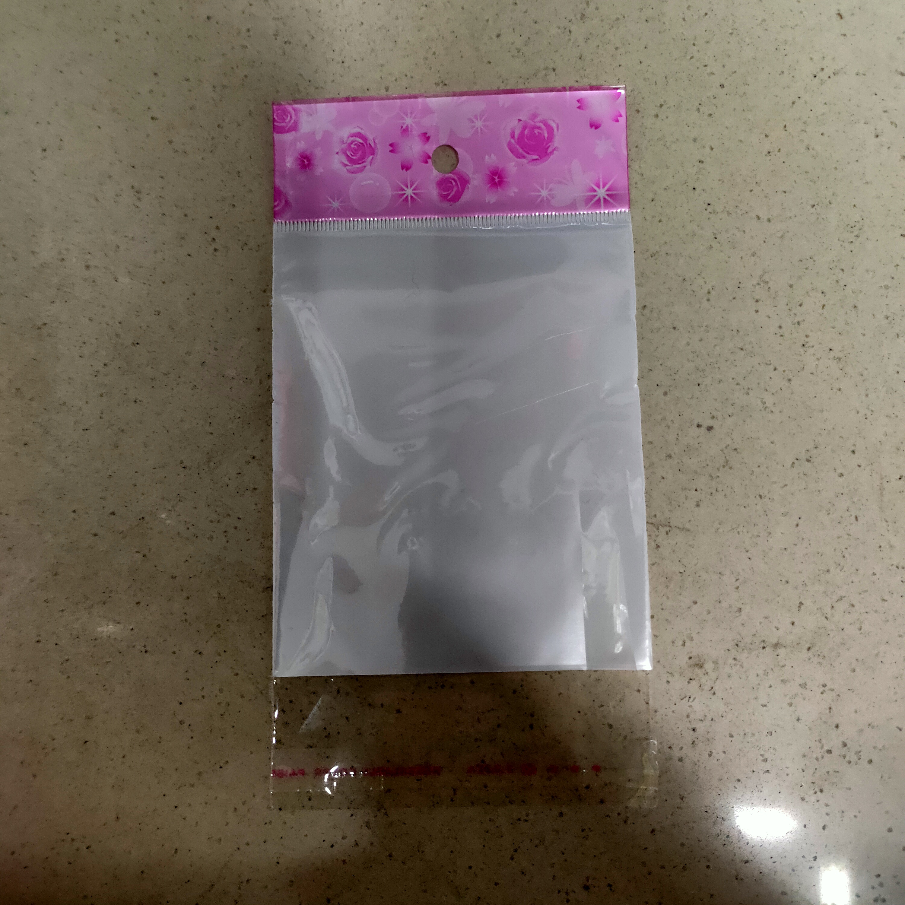 批发定制OPP卡头自粘袋子自封口透明挂孔定制白色珠光塑料小饰品包装胶袋