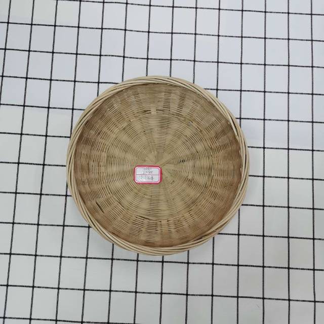 Stylish bamboo basket used indoors with magazines and blankets