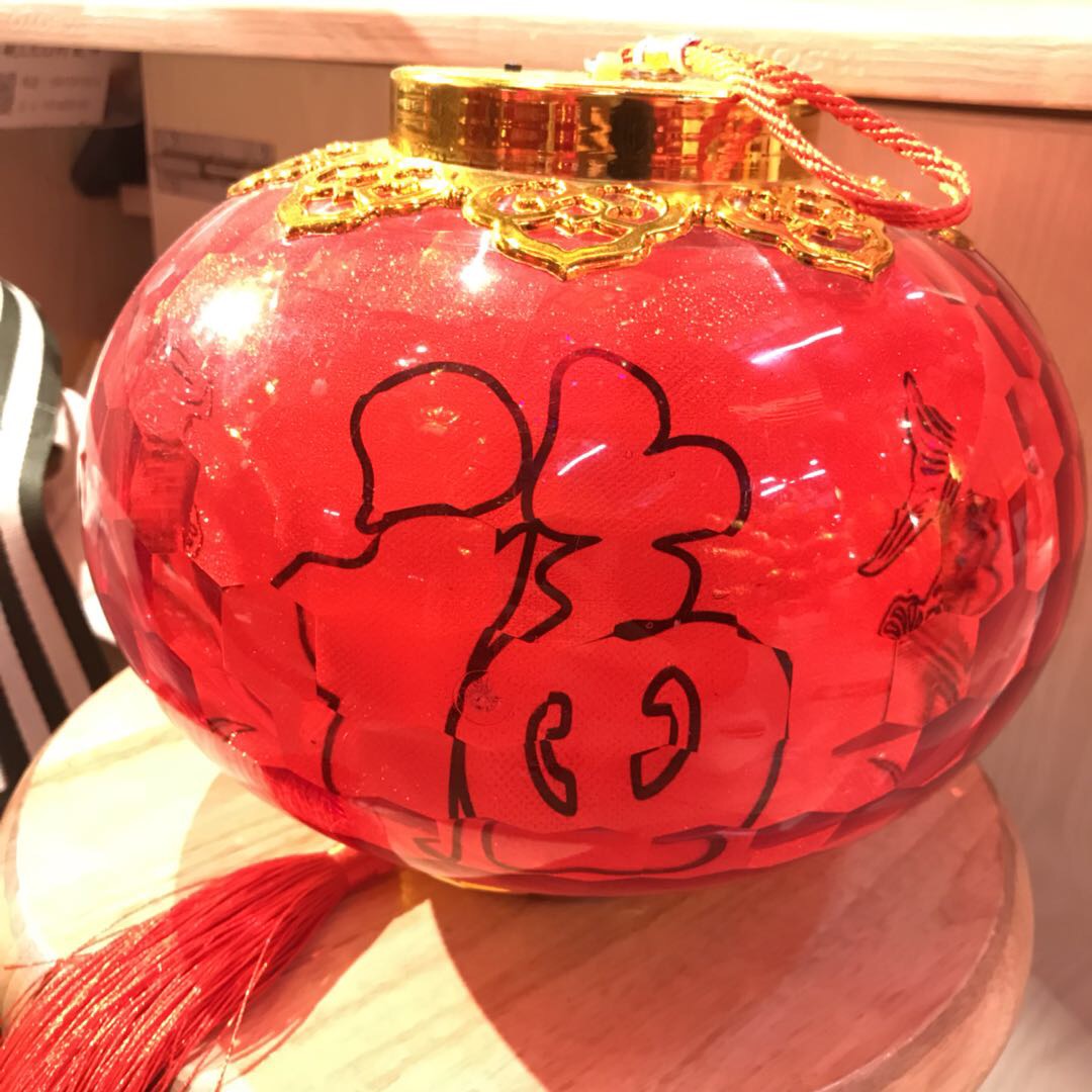 The lantern body is printed with the character "Fu" in bright red, creating a festive and joyous atmosphere