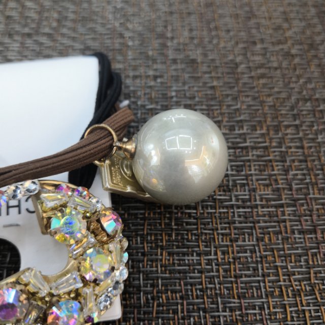 The popular hair tie in Dongdaemun, South Korea, features a water diamond rainbow hair tie, a colorful girl's bell hair band, a hair tie and a hair band headwear Specification image