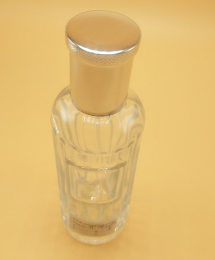 Portable, transparent, logo-shaped glass perfume dispenser bottles