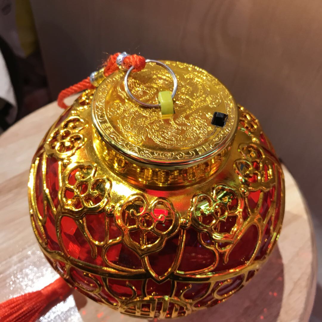 The golden lantern bodies with printed "Fu" characters are magnificent and add to the festive atmosphere details Picture