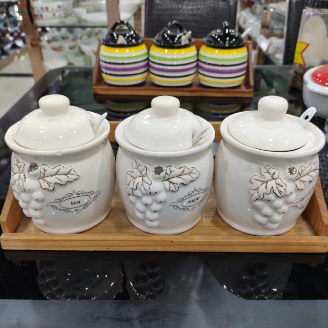 The Golden Edge grape ceramic seasoning jars are available in multiple colors