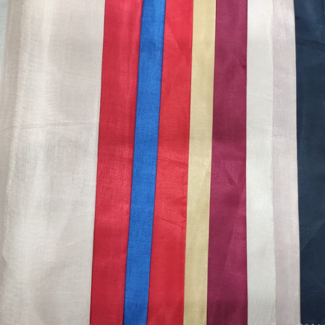 Lightweight spun (silk-like) clothing decorative fabric is available in multiple colors and the price is negotiable