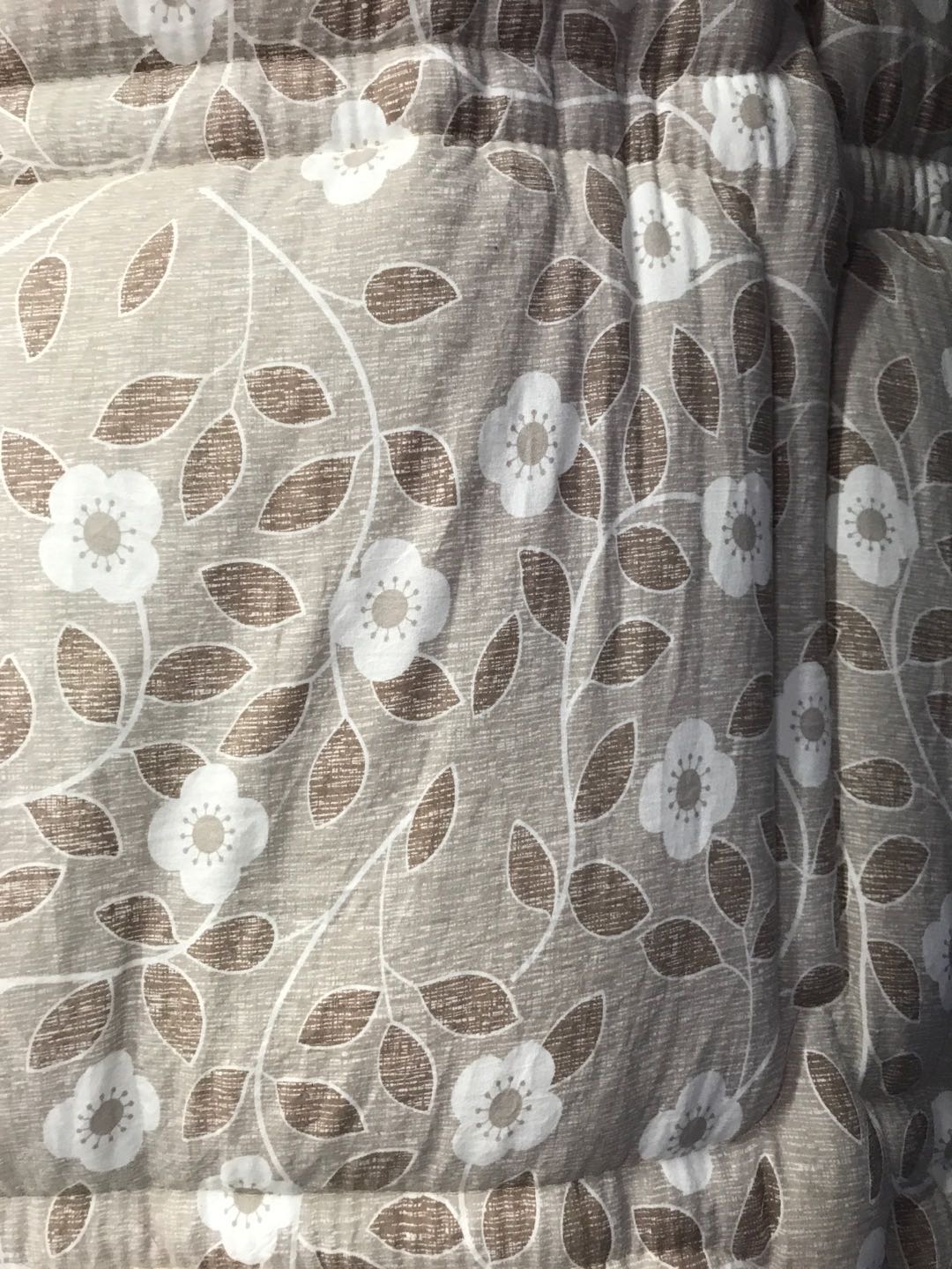 Close-up of vibrant mixed-color print on quilt surface