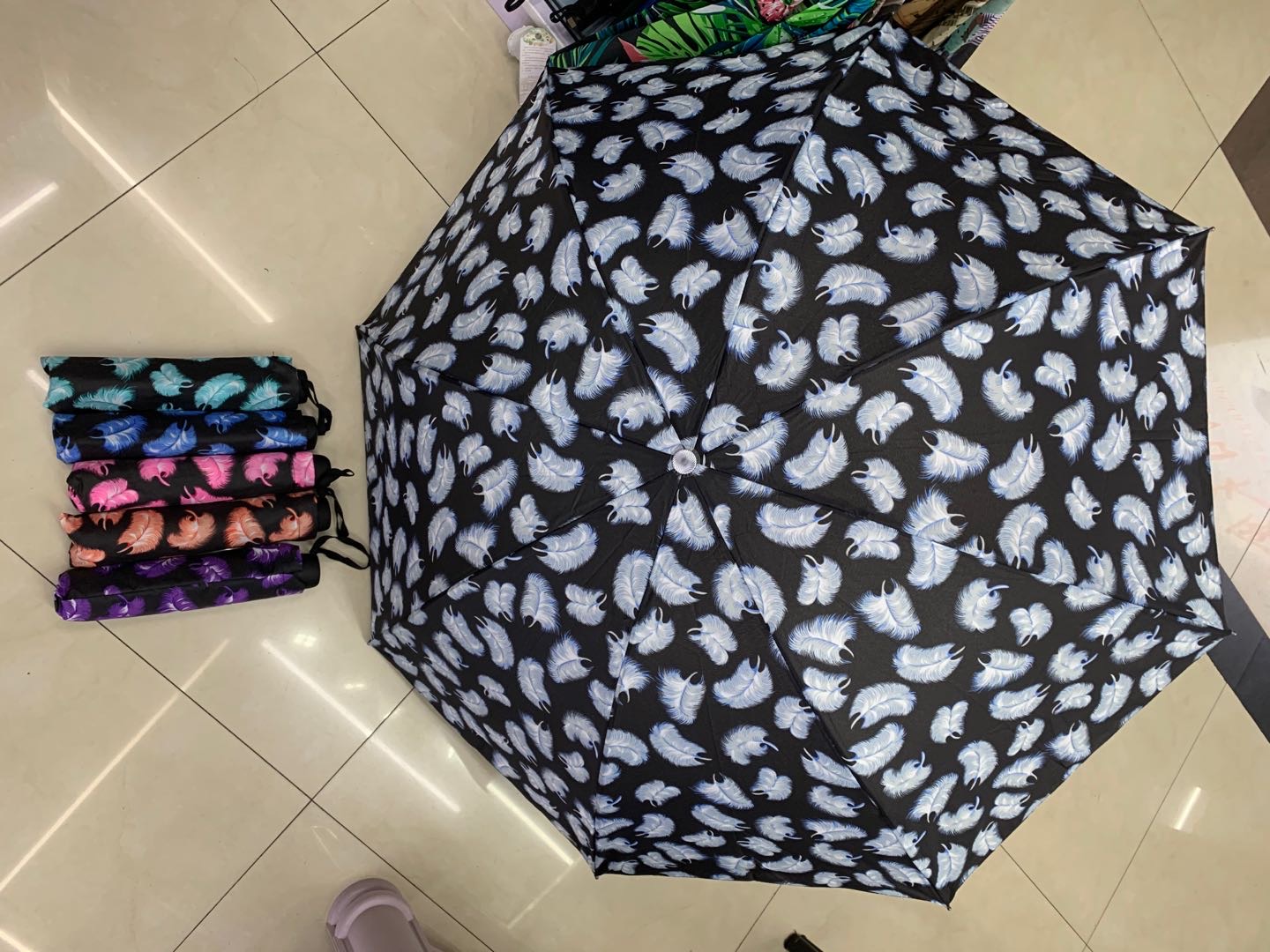 Portable three-fold umbrella with floral fringes for both weather and rain details Picture