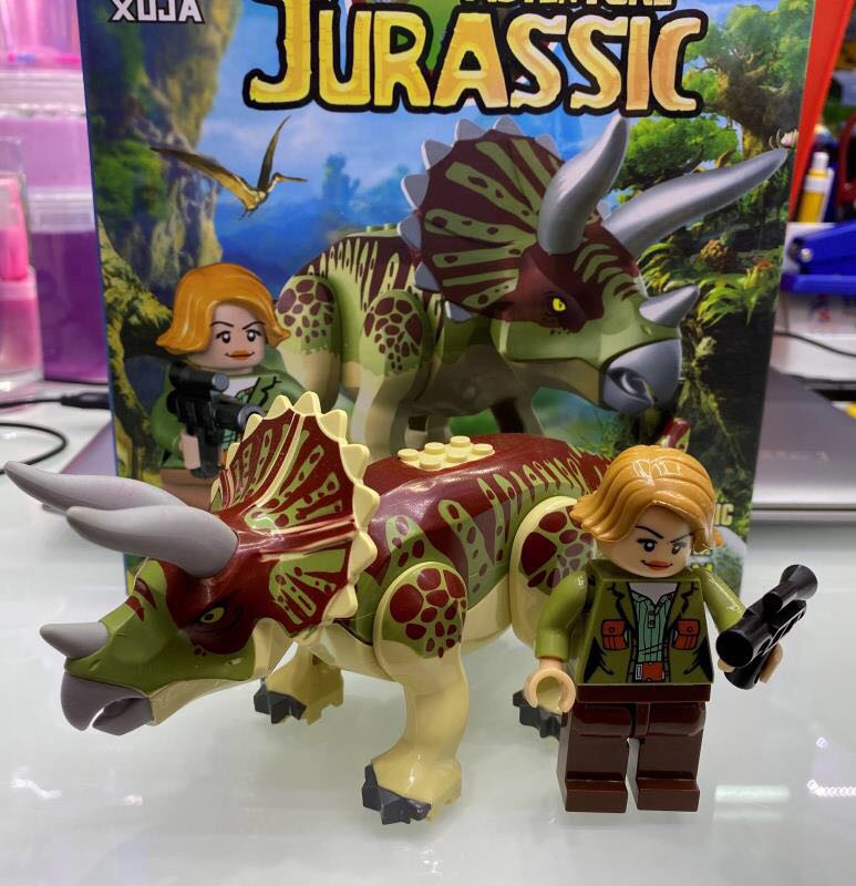 Children's Toy set assembled from the Jurassic adventure Dinosaur Man-cub T. Rex