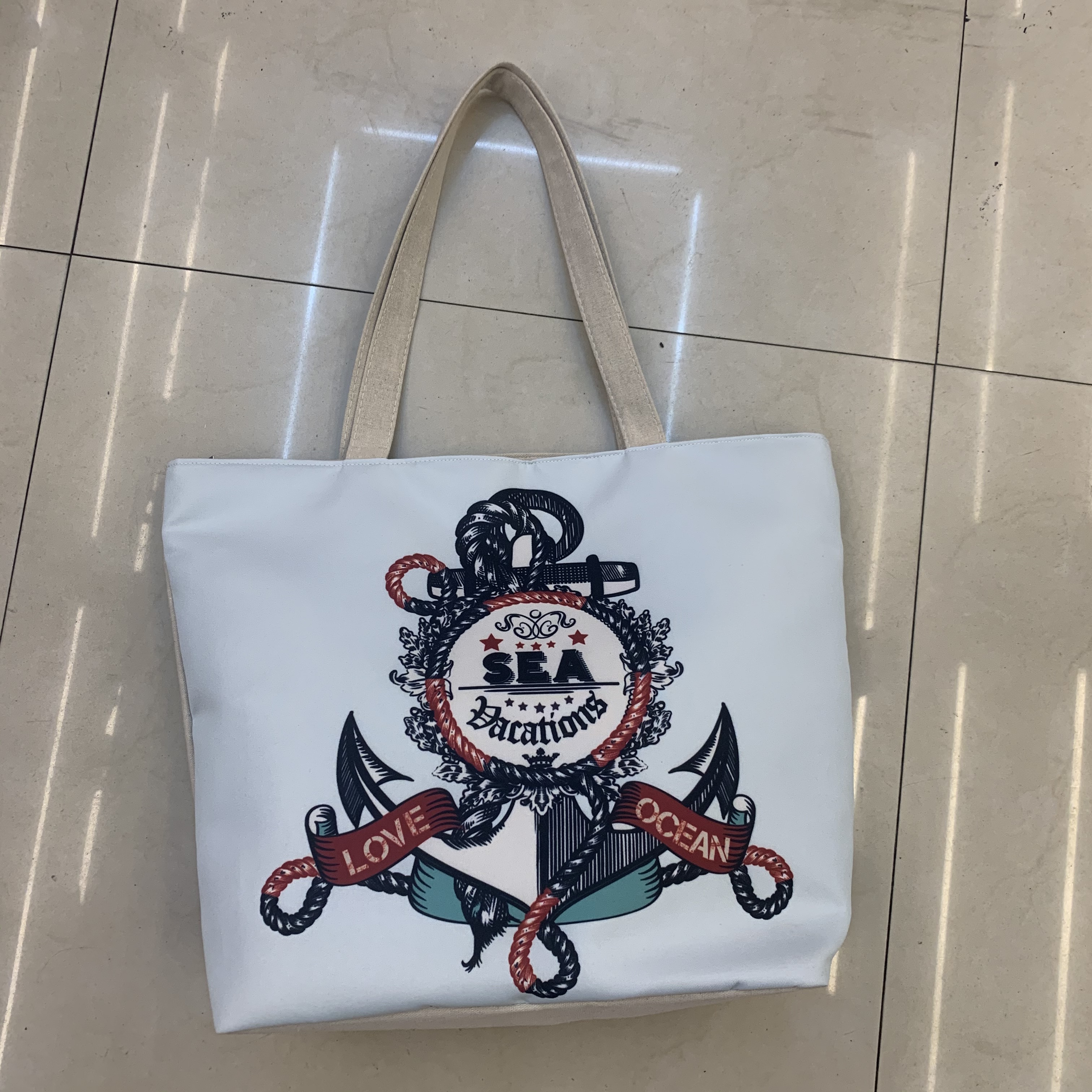 单肩大包女印花字母新款大容量旅游沙滩ins潮手提白色帆布包