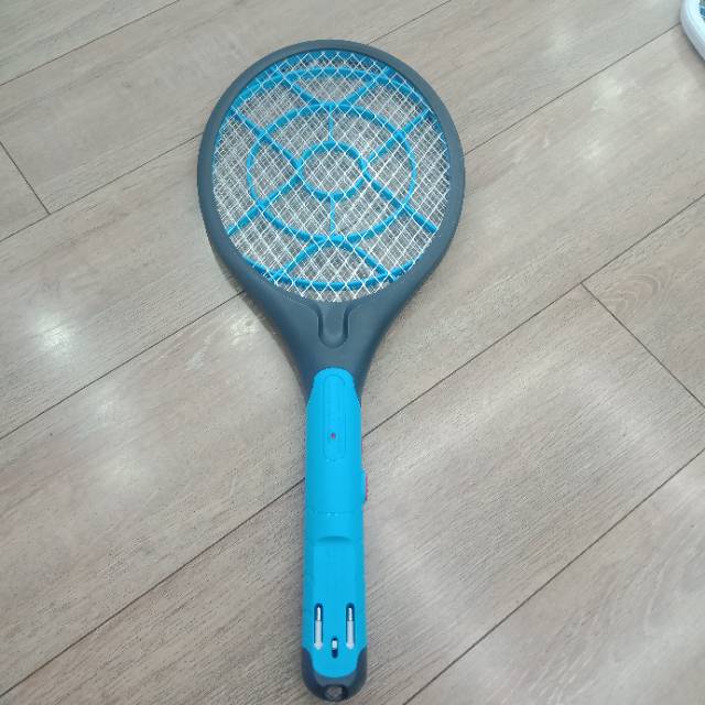 A round dark blue electric mosquito bat is portable for home use thumbnail