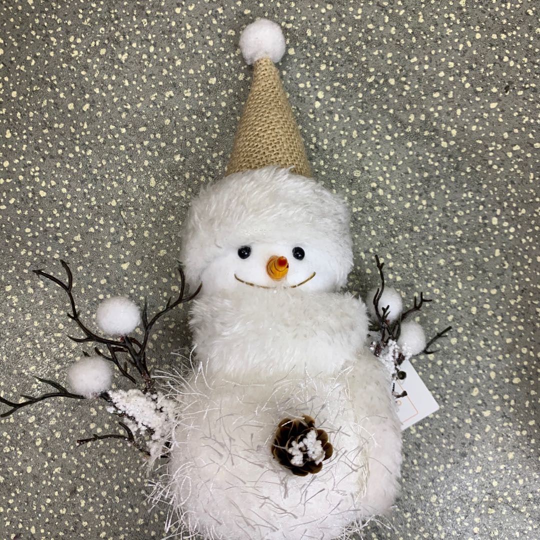 A stuffed snowman tabletop for Christmas decorations for Christmas presents thumbnail