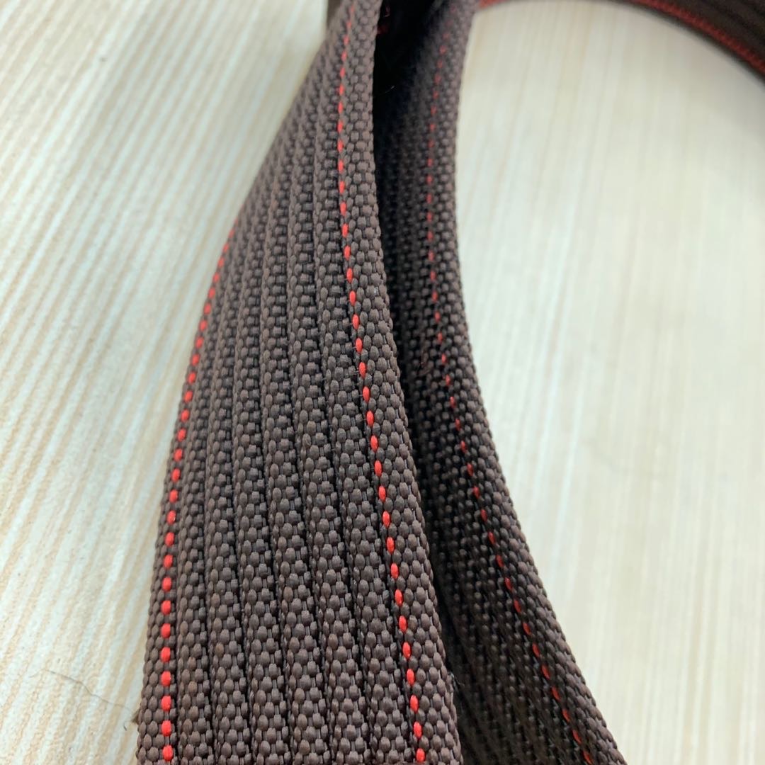 Belt being adjusted on jeans