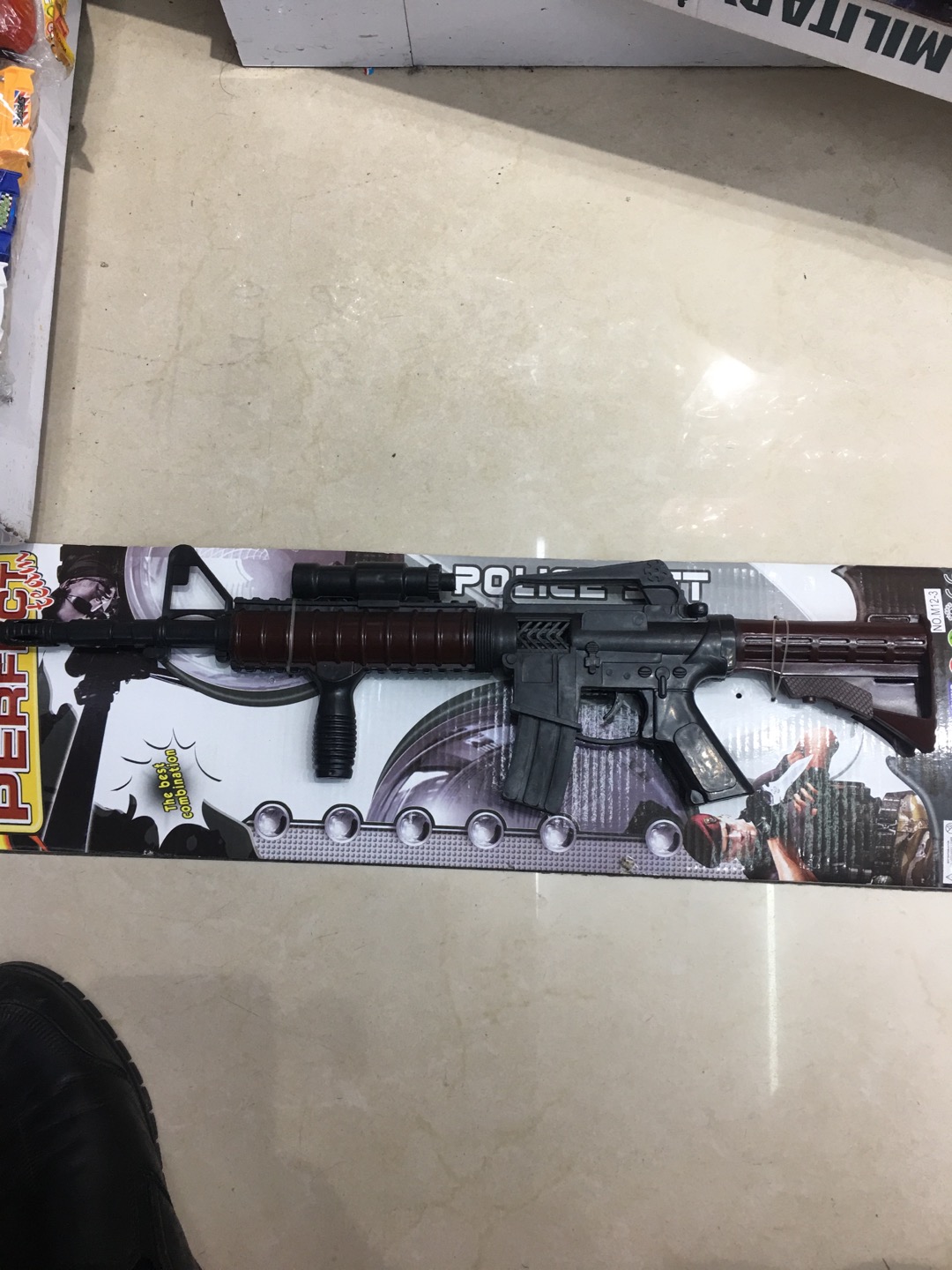 A child's plastic model of a toy gun thumbnail