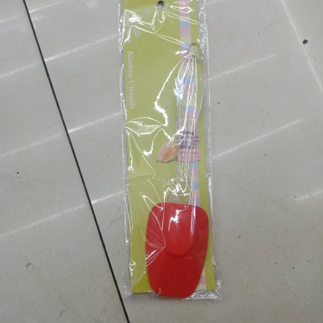 A large red silicone spatula for fruits at home