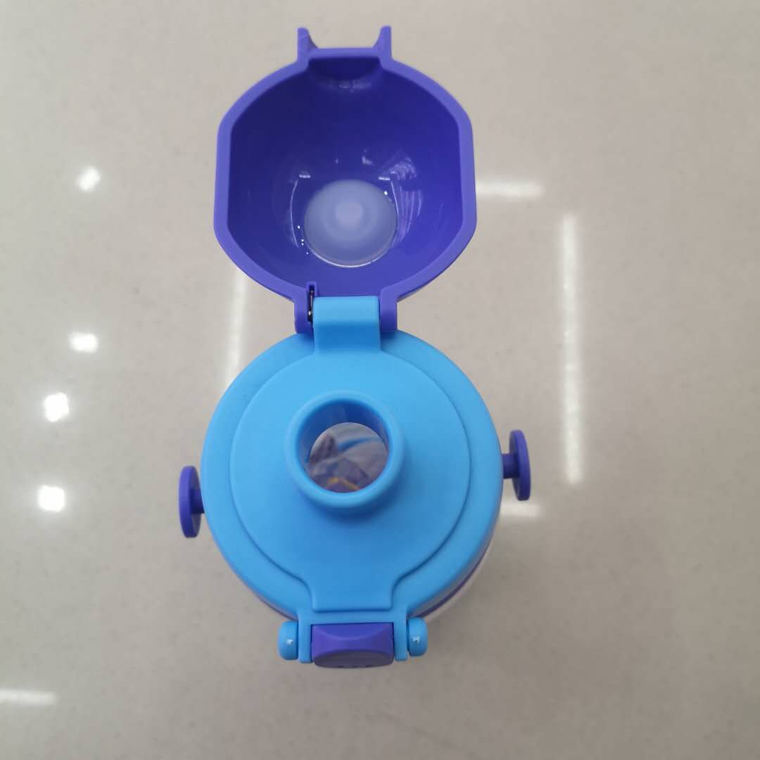 Transparent kids sippy cup showing clear view of liquid inside
