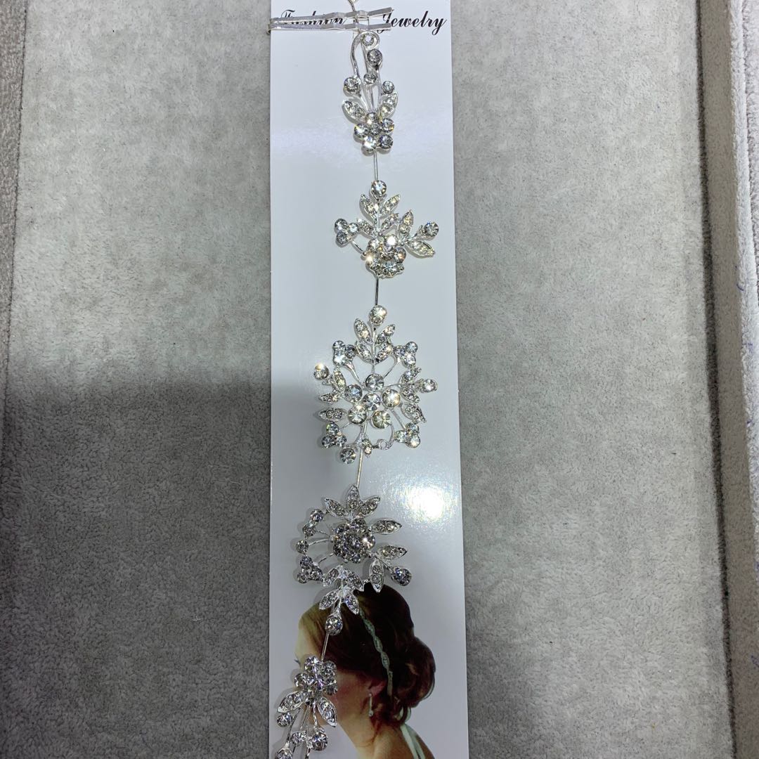 The bride with branches, handcrafted with drill bits, wears wedding dress accessories and headwear