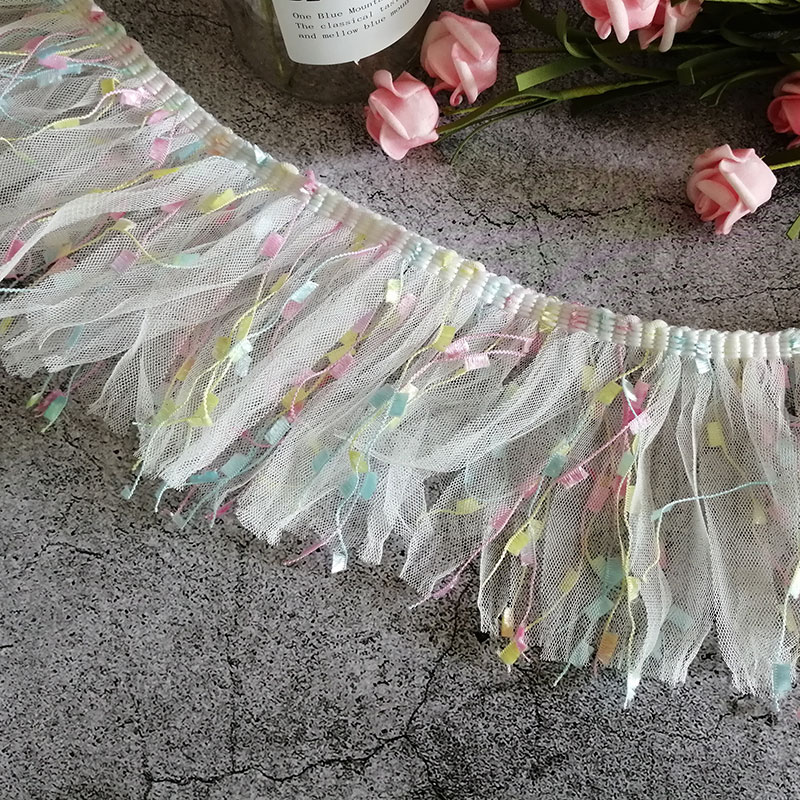 A super cute and fairy-like white macaron tassel and beaded children's doll lace mesh dress