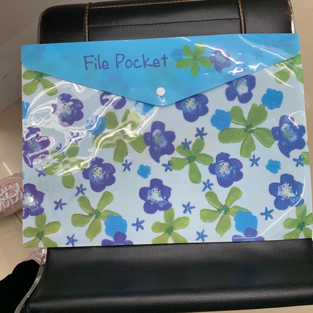 The A4-sized blue file bag is rainproof and dust-proof