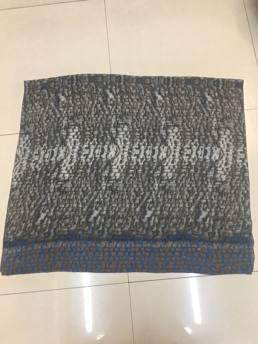 A trendy and popular women's scarf: a thin snake-skin square creased long scarf