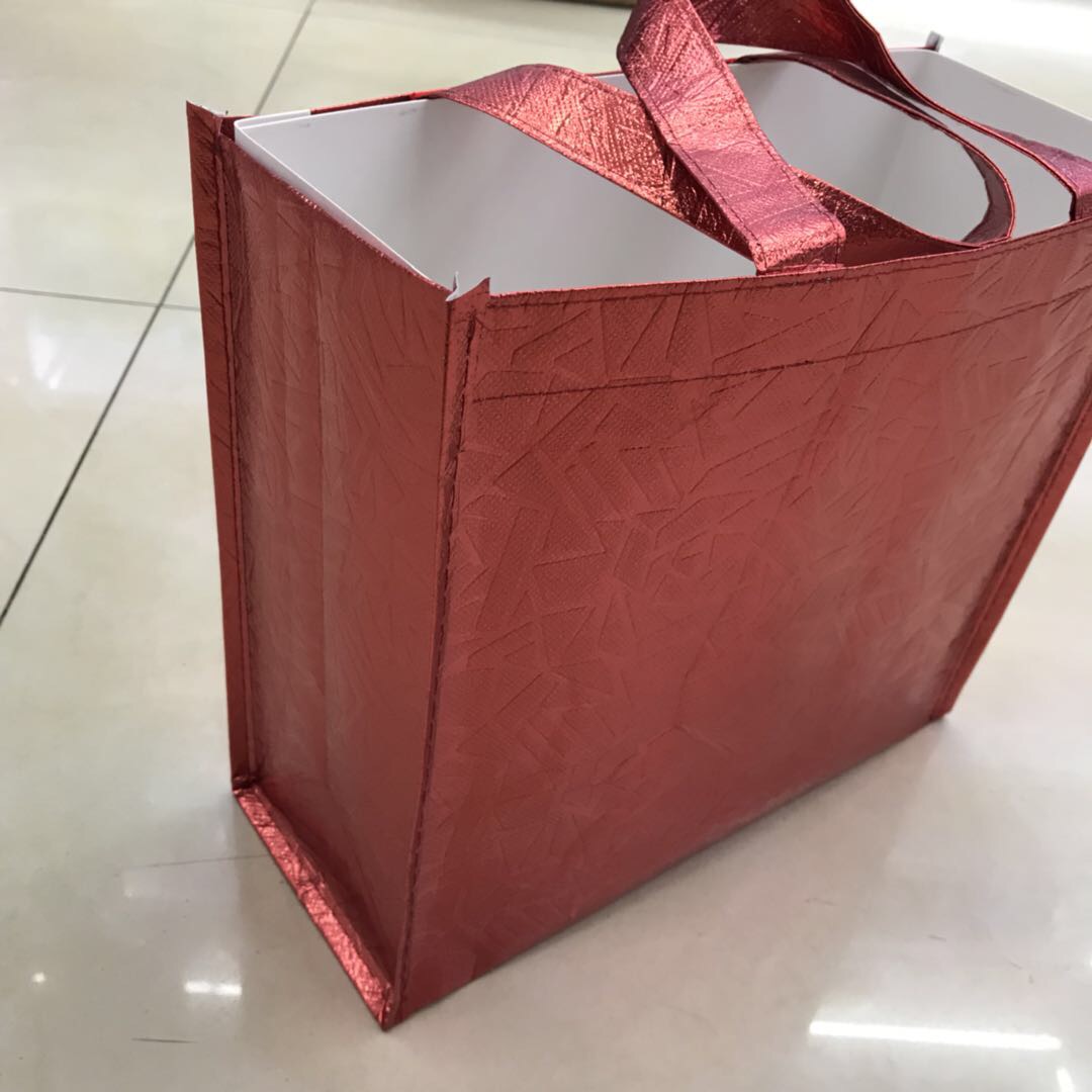 Factory direct sales of hand-held bright film faucet bags, three-dimensional bags, horizontal and vertical customized shopping bags Specification image