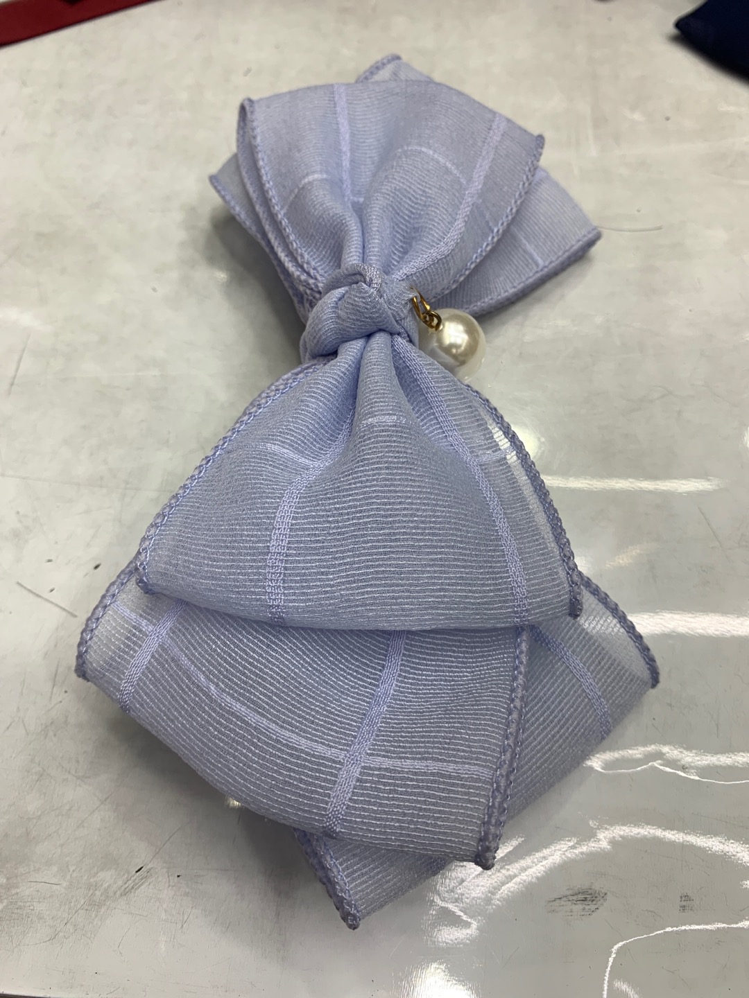 New silk satin, gauze and linen fabric with pearl bow hair clip details Picture