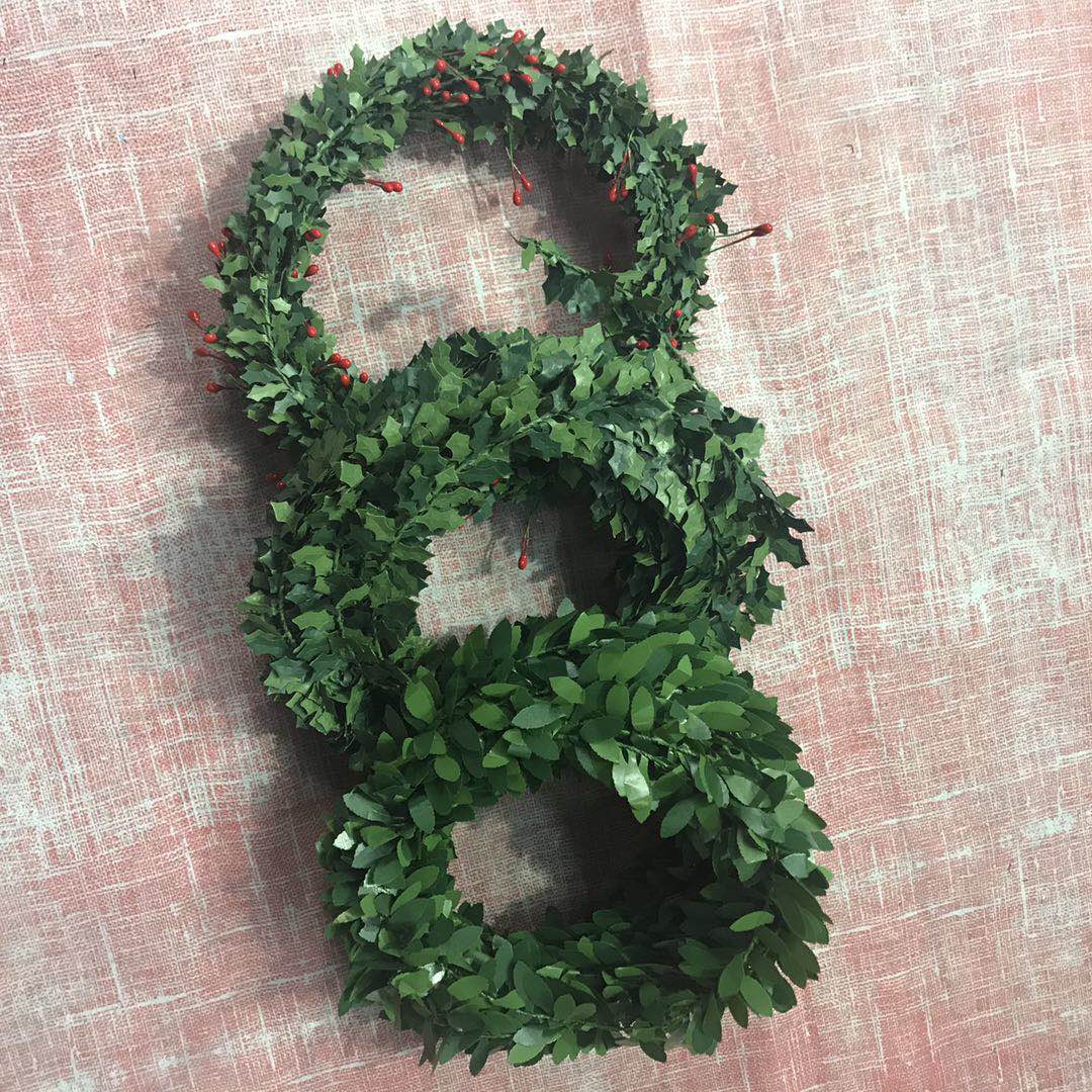 Decorative vines, artificial flowers, entwined pipes, artificial leaves, plastic green plants