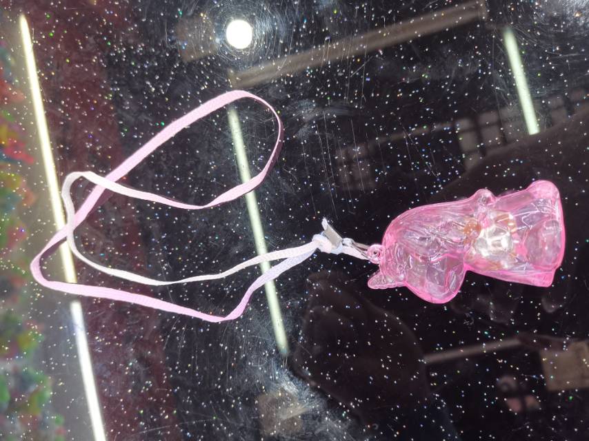 Unicorn-shaped electronic shiny pendant made of plastic has three functions