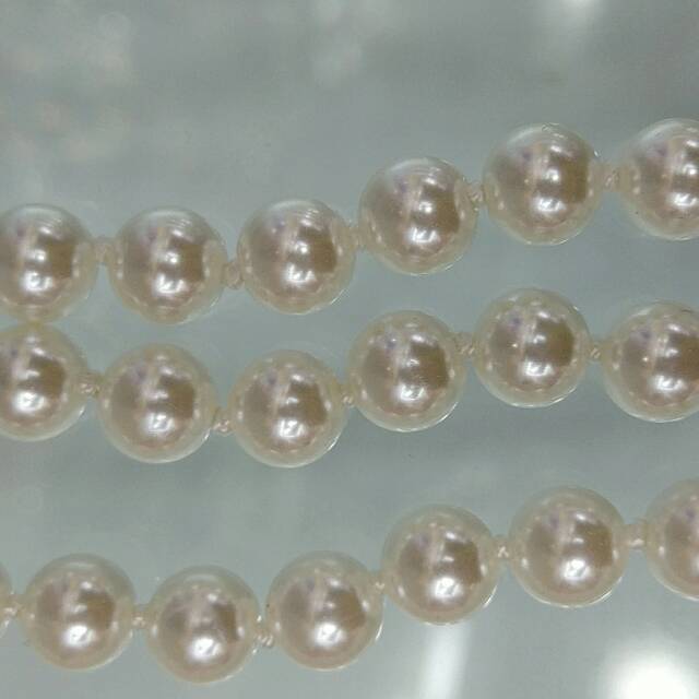 A multi-layer imitation pearl necklace is a creative, simple and elegant birthday gift for a girl Specification image