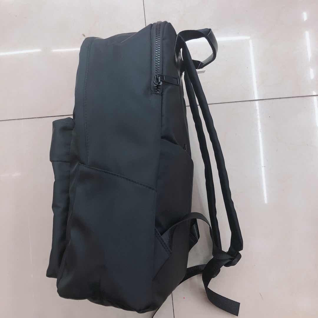 Black simple primary school bag 1-3-6 grade backpack, 6-12 years old ultra-light waterproof and load-reducing bag for boys and girls details Picture