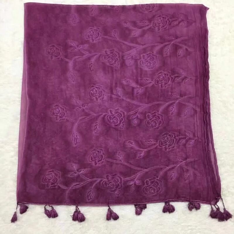 A female Muslim scarf with a dirty, stained, full head embroidered, and a double-headed beard