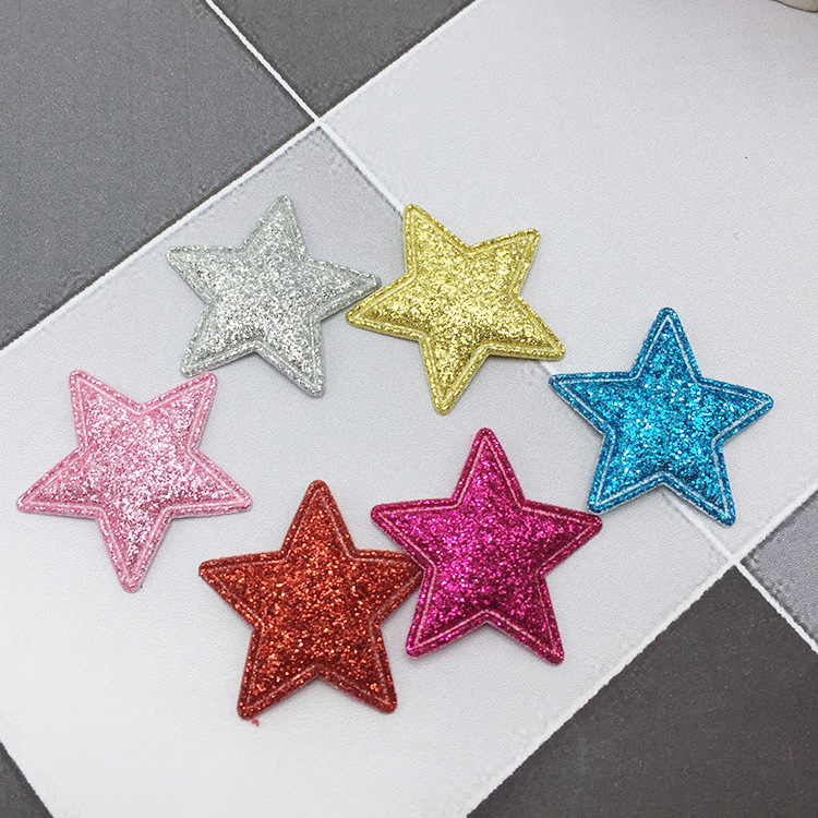 Child wearing gold star hair clips in braided hairstyle