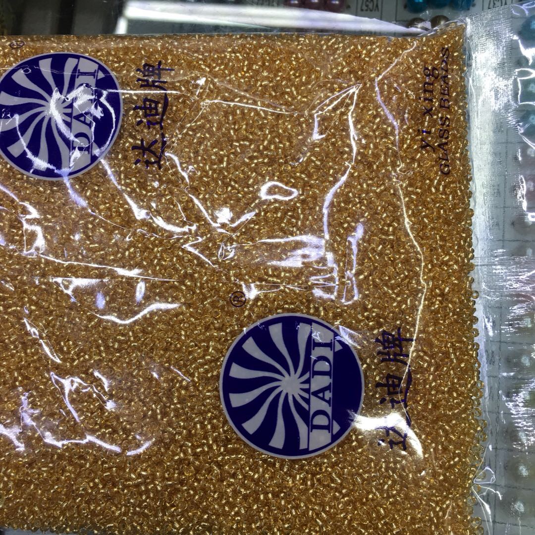 Factory direct sales: One pack of Dadi brand glass golden rice beads