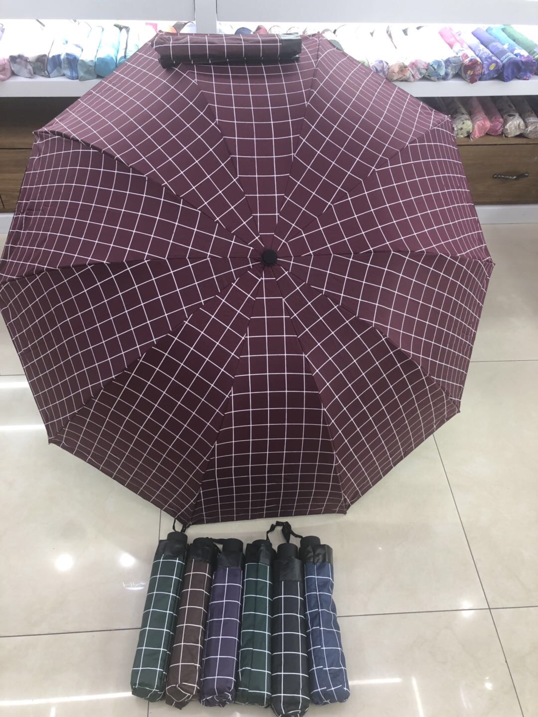 65 vinyl plaid extra heavy rain triple fold umbrella