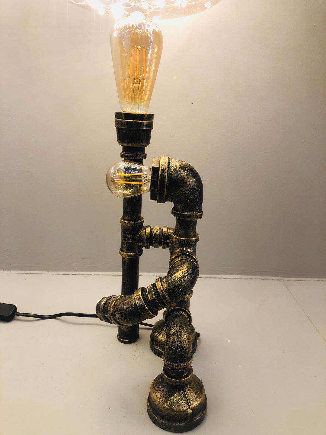 Industrial-style table lamp, personalized and creative decoration, coffee shop and bar table lamp, led retro and creative robot water pipe table lamp details Picture